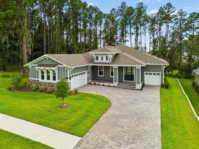 Front exterior of a new home in Southern Hills Plantation, Brooksville, FL, highlighting curb appeal (Image 26). Front exterior of a new home in Southern Hills Plantation, Brooksville, FL, highlighting curb appeal (Image 26).