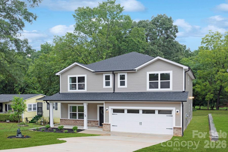 Front exterior of a new home in , Huntersville, NC, highlighting curb appeal (Image 25).