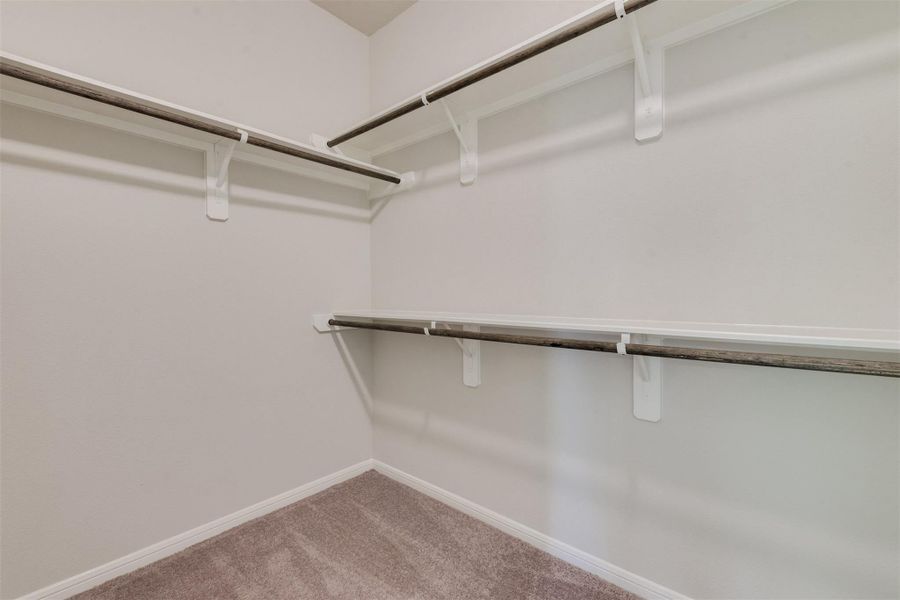 Spacious, unfurnished interior of a new home in Sunterra, Katy (Image 20).