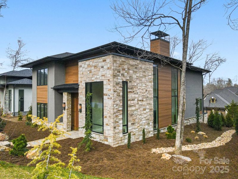 Front exterior of a new home in , Arden, NC, highlighting curb appeal (Image 21).