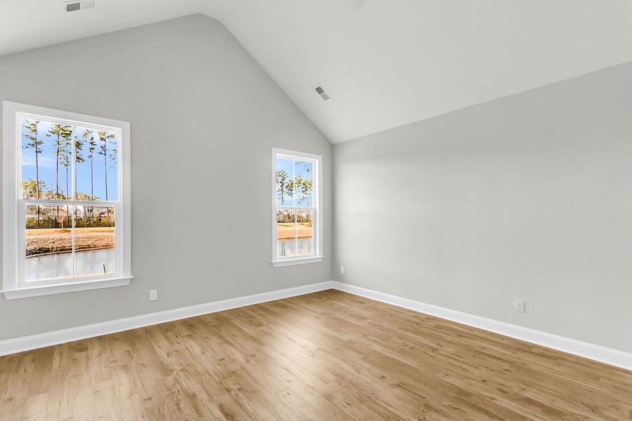 Spacious, unfurnished interior of a new home in Tidewater at Lakes of Cane Bay, Summerville (Image 35).
