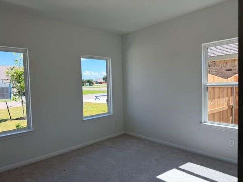 Light gray painted walls with white trim and gray carpeting Light gray painted walls with white trim and gray carpeting
