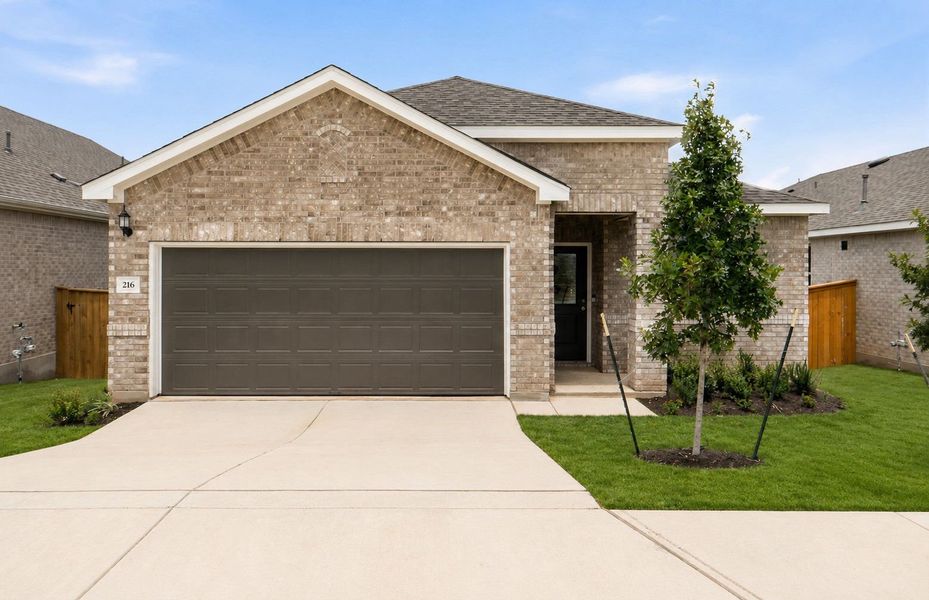 Front exterior of a new home in La Cima, San Marcos, TX, highlighting curb appeal (Image 20).