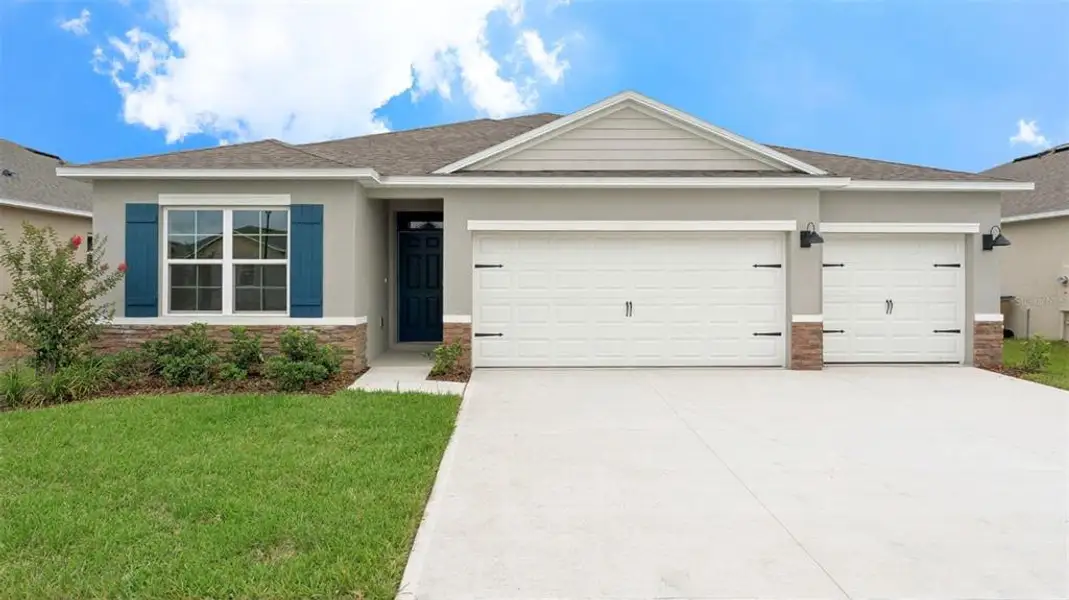 Front exterior of a new home in Wexford Cove, Ormond Beach, FL, highlighting curb appeal (Image 1). Front exterior of a new home in Wexford Cove, Ormond Beach, FL, highlighting curb appeal (Image 1).