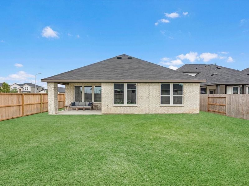 Exterior details and patio area of a home in Mason Woods, Cypress (Image 4).