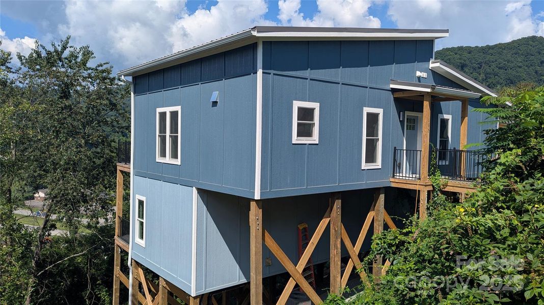 Front exterior of a new home in , Waynesville, NC, highlighting curb appeal (Image 15).