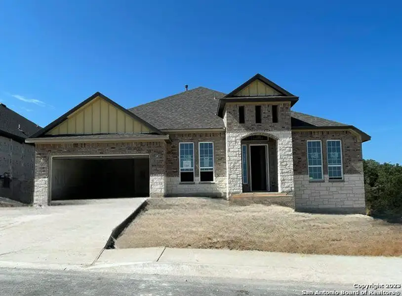 Front exterior of a new home in Sunday Creek at Kinder Ranch, San Antonio, TX, highlighting curb appeal (Image 2). Front exterior of a new home in Sunday Creek at Kinder Ranch, San Antonio, TX, highlighting curb appeal (Image 2).