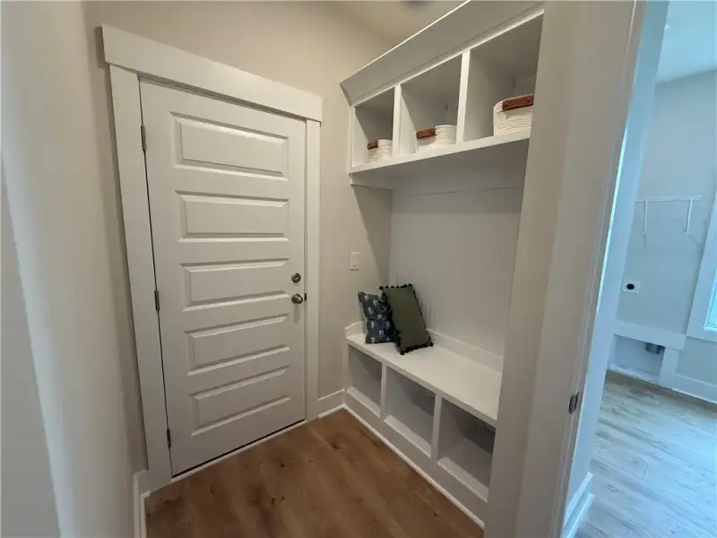 Functional mudroom area showcases a built-in bench