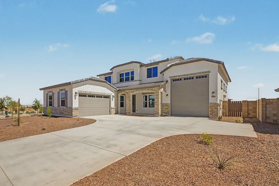Front exterior of a new home in Valencia at Granite Vista, Waddell, AZ, highlighting curb appeal (Image 2). Front exterior of a new home in Valencia at Granite Vista, Waddell, AZ, highlighting curb appeal (Image 2).