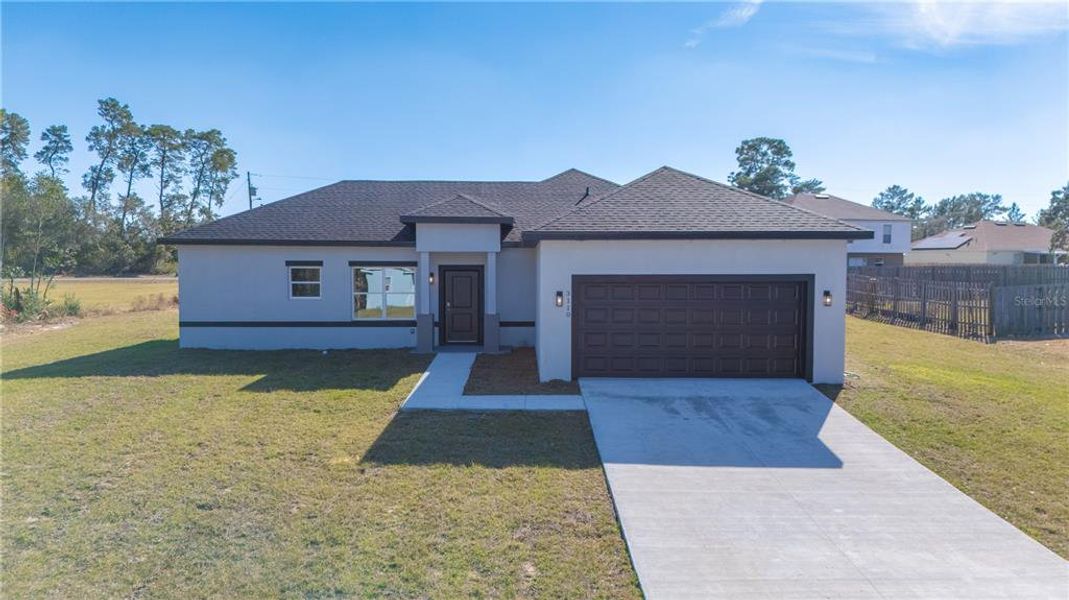 Front exterior of a new home in , Ocala, FL, highlighting curb appeal (Image 12).