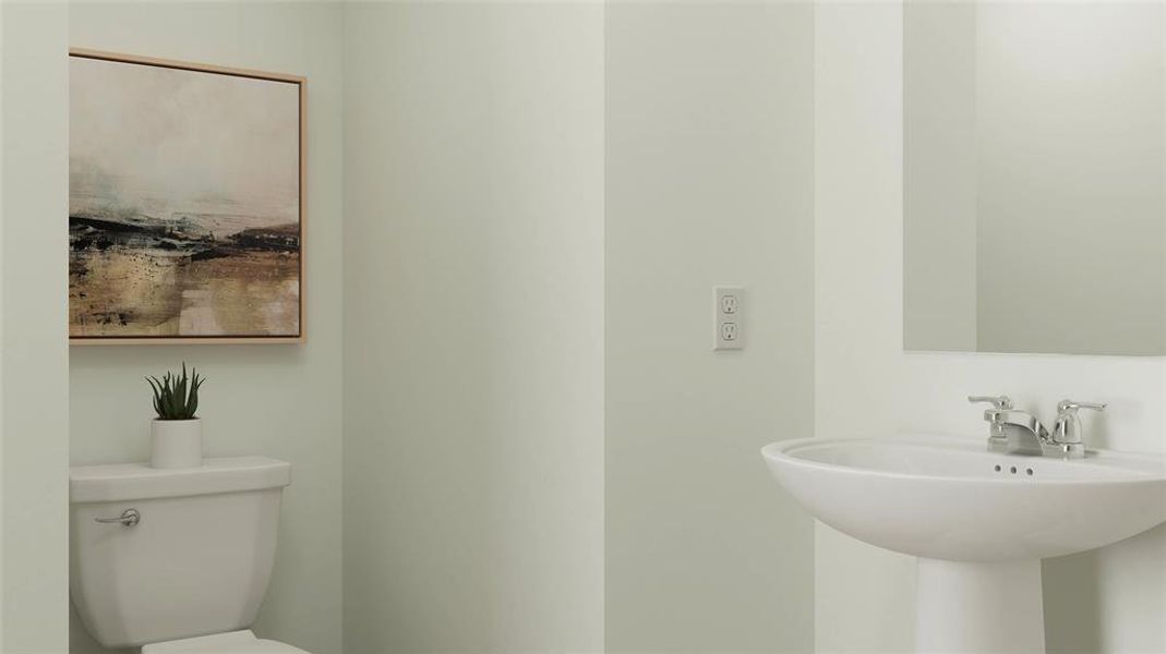 Bathroom featuring toilet and sink