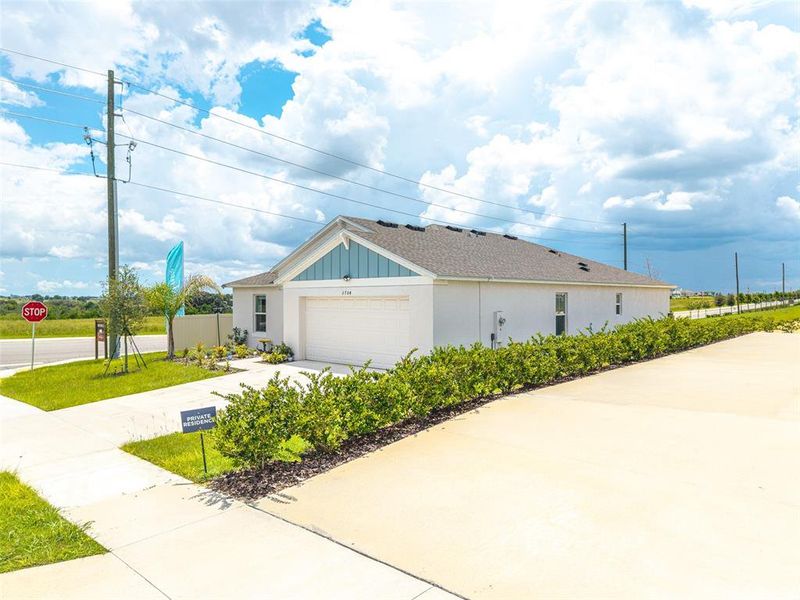 Front exterior of a new home in , Haines City, FL, highlighting curb appeal (Image 16).