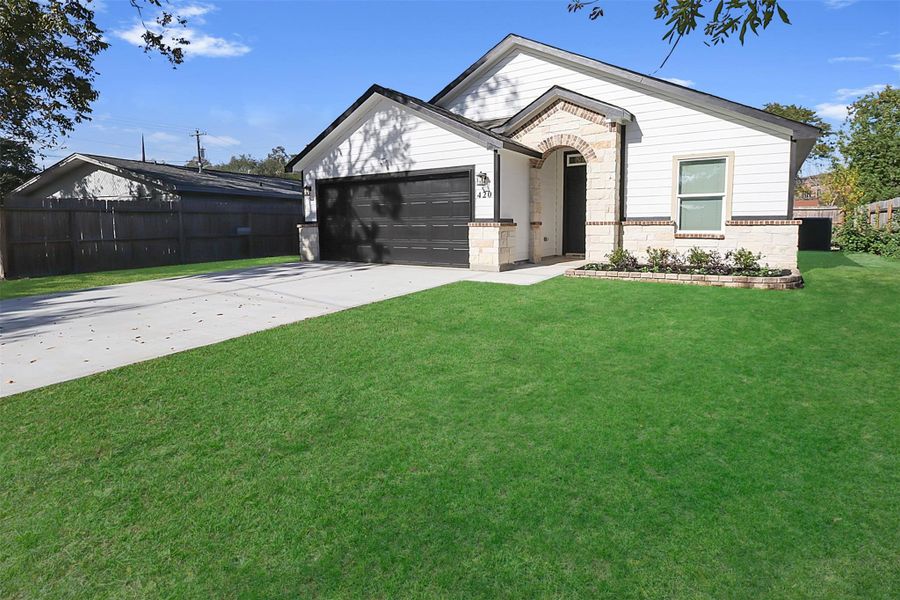 Front exterior of a new home in , Baytown, TX, highlighting curb appeal (Image 2).