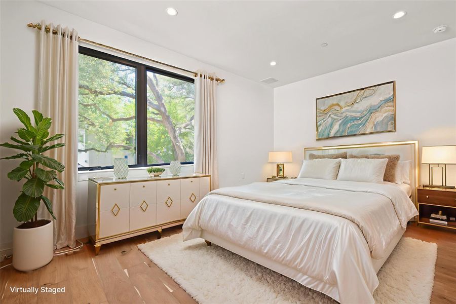 Bedroom featuring light wood-type flooring and recessed lighting