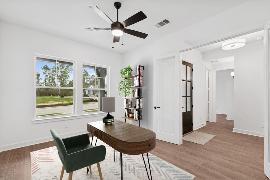 Private study off Entry offers large windows, high ceilings, and low maintenance flooring! Plus a ceiling fan!