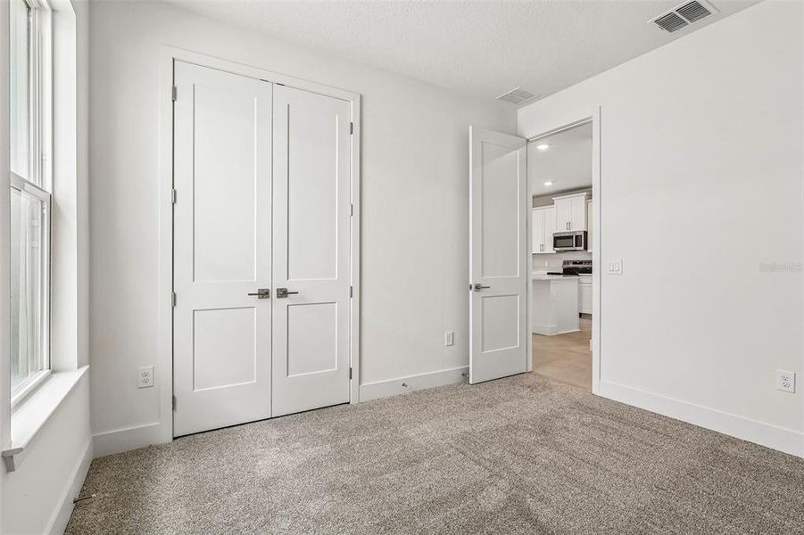 Spacious, unfurnished interior of a new home in Lakeside at Satilla, St. Cloud (Image 25).