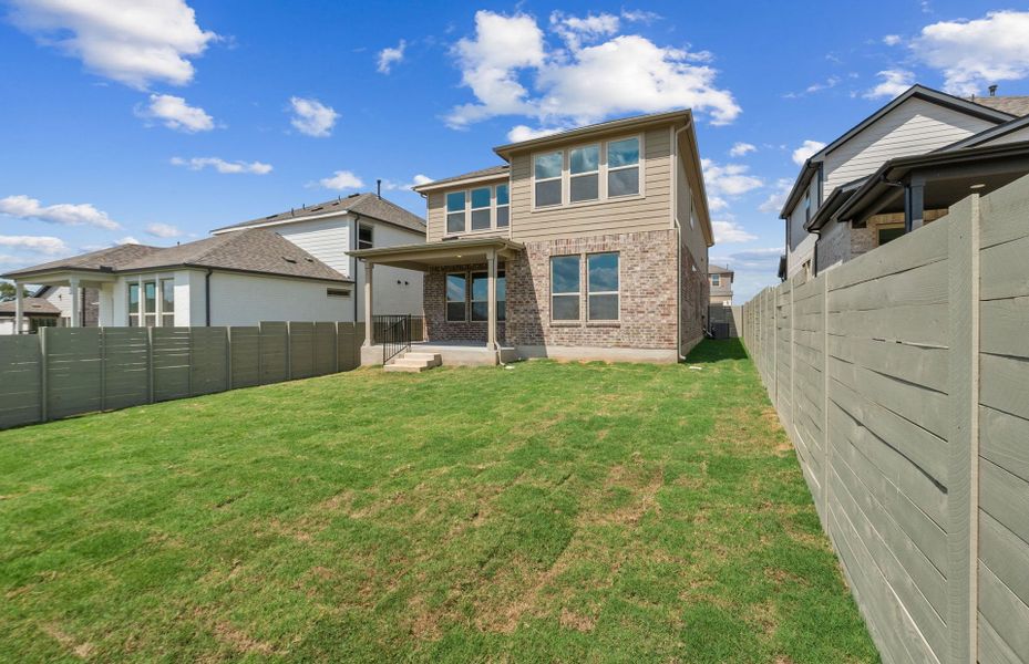 Exterior details and patio area of a home in Wolf Ranch, Georgetown (Image 23).