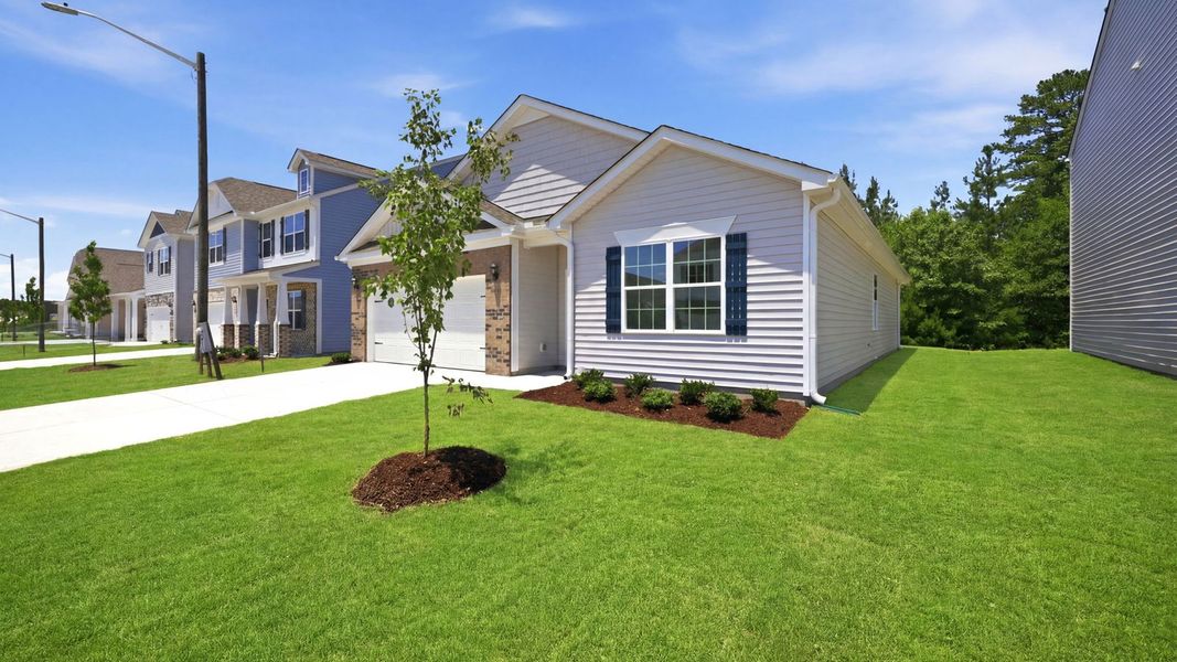 Front exterior of a new home in Ridgewood Farms, Winterville, NC, highlighting curb appeal (Image 18). Front exterior of a new home in Ridgewood Farms, Winterville, NC, highlighting curb appeal (Image 18).