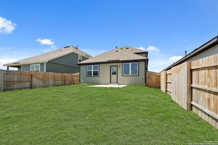 Front exterior of a new home in Hickory Ridge, Elmendorf, TX, highlighting curb appeal (Image 19). Front exterior of a new home in Hickory Ridge, Elmendorf, TX, highlighting curb appeal (Image 19).