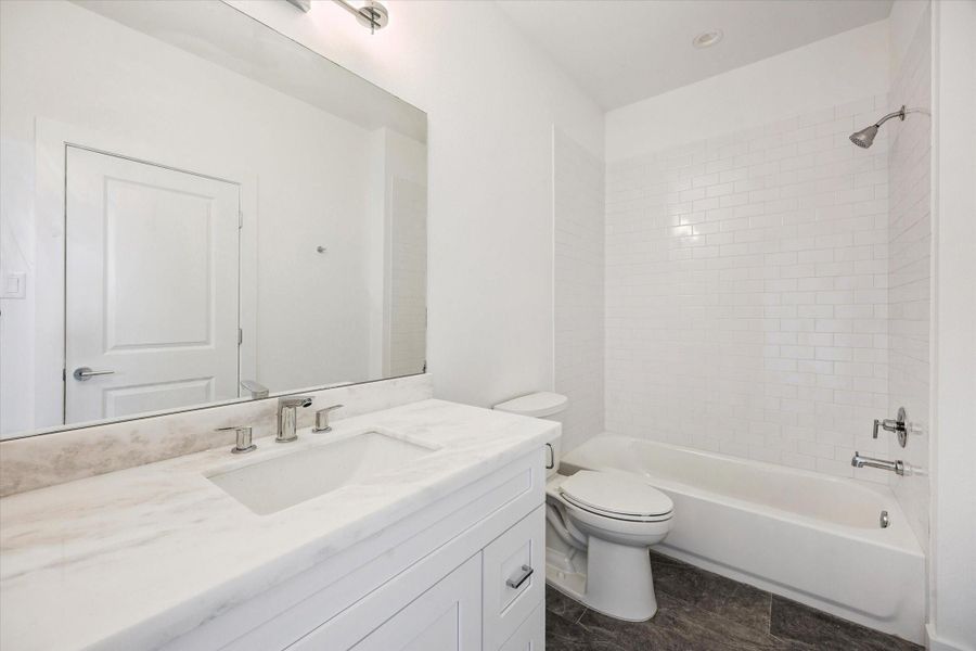 En-Suite Bathroom for the Third Floor Bedroom * Porcelain Tile Floor * Marble Counter * Modern Fixtures. En-Suite Bathroom for the Third Floor Bedroom * Porcelain Tile Floor * Marble Counter * Modern Fixtures.