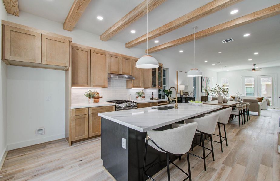 View of the kitchen looking out towards the dining and living areas. Spacious and bright, ready for entertaining friends and family!