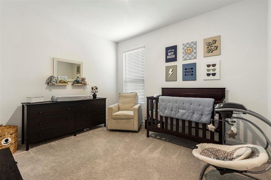 Interior room featuring light carpeting and white painted walls Interior room featuring light carpeting and white painted walls