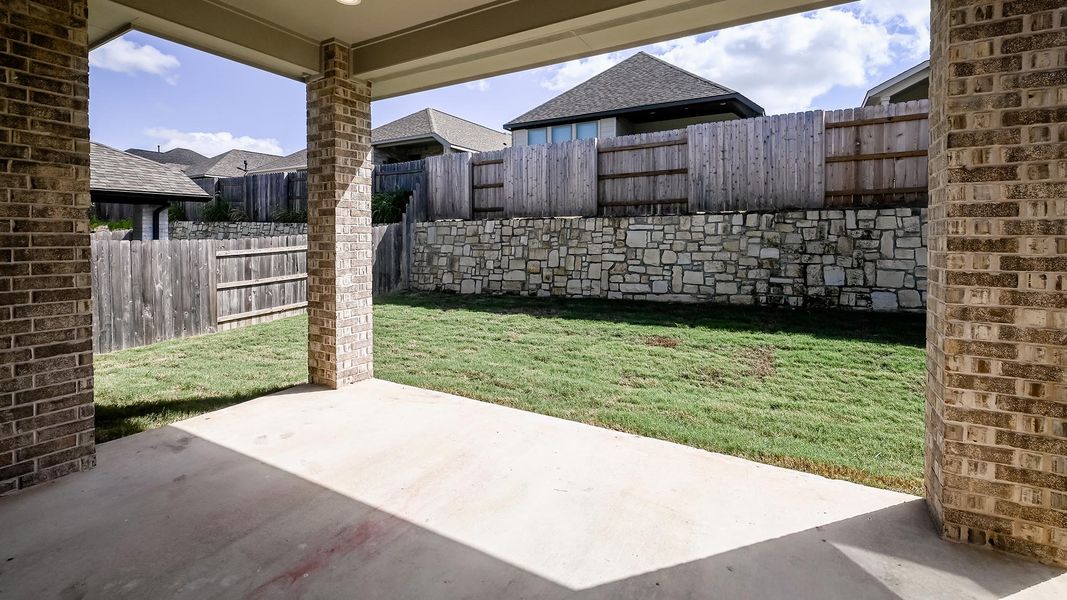 Exterior details and patio area of a home in Crosswinds, Kyle (Image 3).
