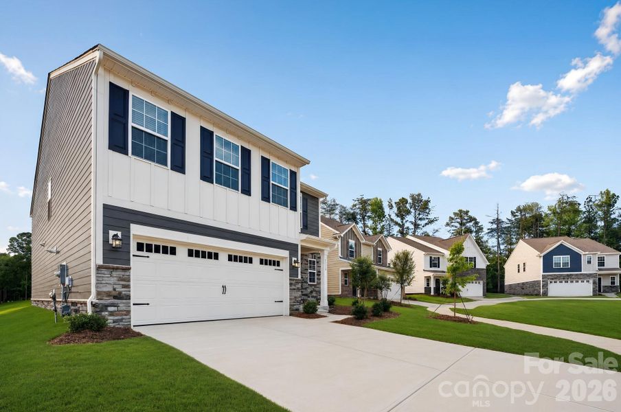 Front exterior of a new home in Cannon Village, York, SC, highlighting curb appeal (Image 2). Front exterior of a new home in Cannon Village, York, SC, highlighting curb appeal (Image 2).
