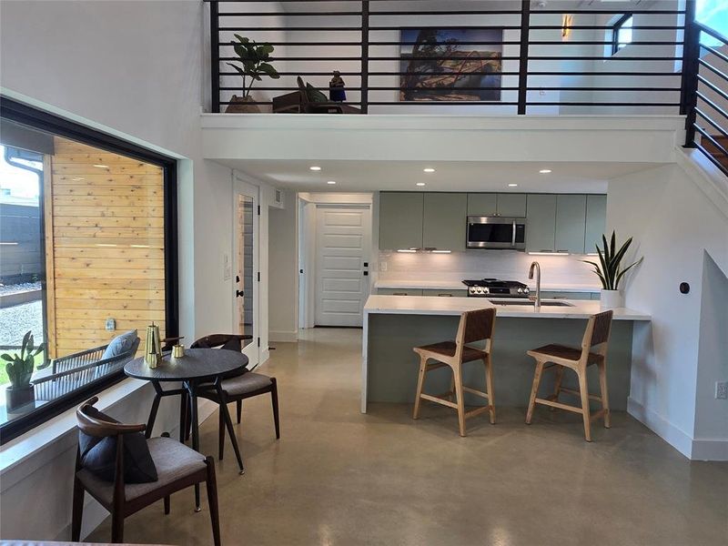 Kitchen with the eat in peninsula all part of the large living space.