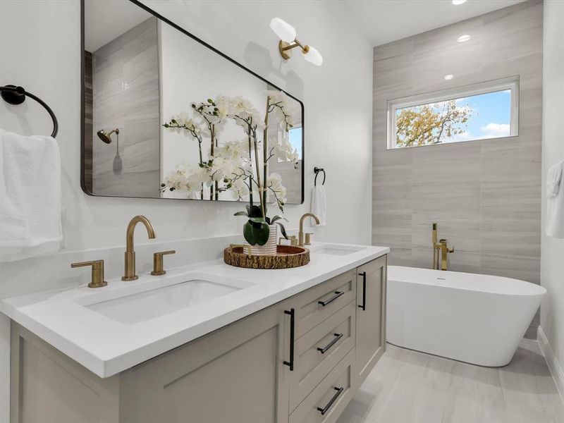 Bathroom with a tub to relax in and vanity