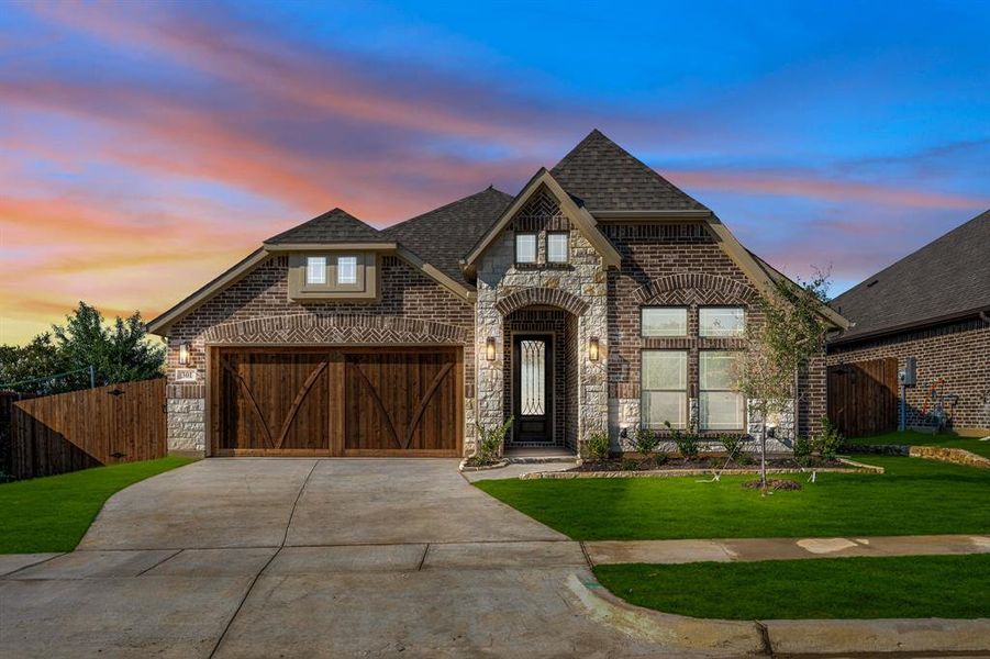 Front exterior of a new home in Parks at Panchasarp Farms 55-60, Burleson, TX, highlighting curb appeal (Image 1).