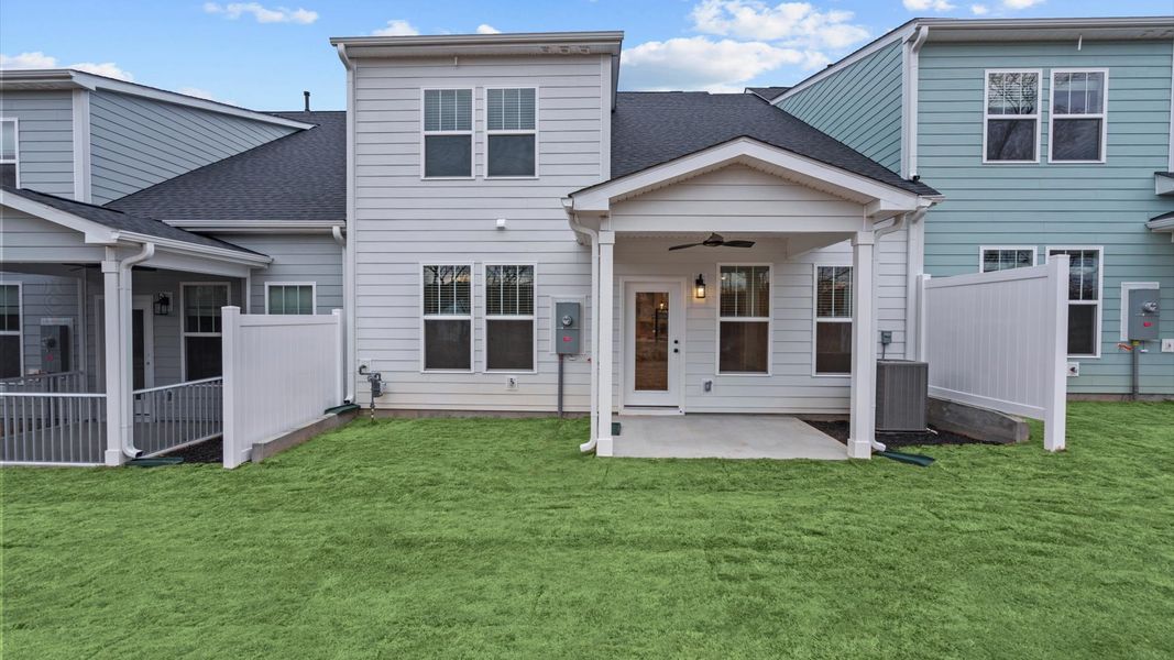Rear covered porch offers a private, first-rate setting for outdoor enjoyment