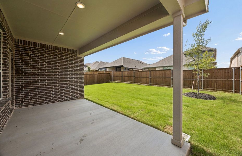 Exterior details and patio area of a home in Creekview Meadows, Pilot Point (Image 3). Exterior details and patio area of a home in Creekview Meadows, Pilot Point (Image 3).
