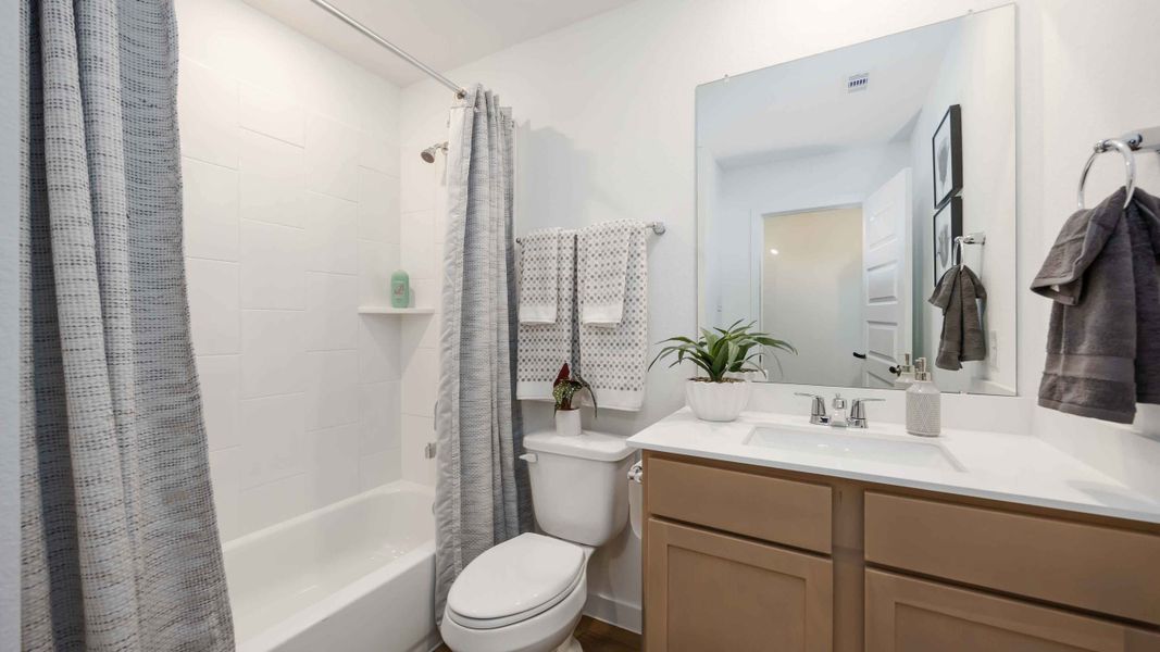 Furnished interior view inside a new home in Grand West, Houston (Image 8).