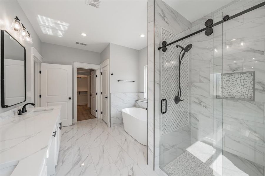 Bathroom with vanity, plus walk in shower, and tile patterned flooring