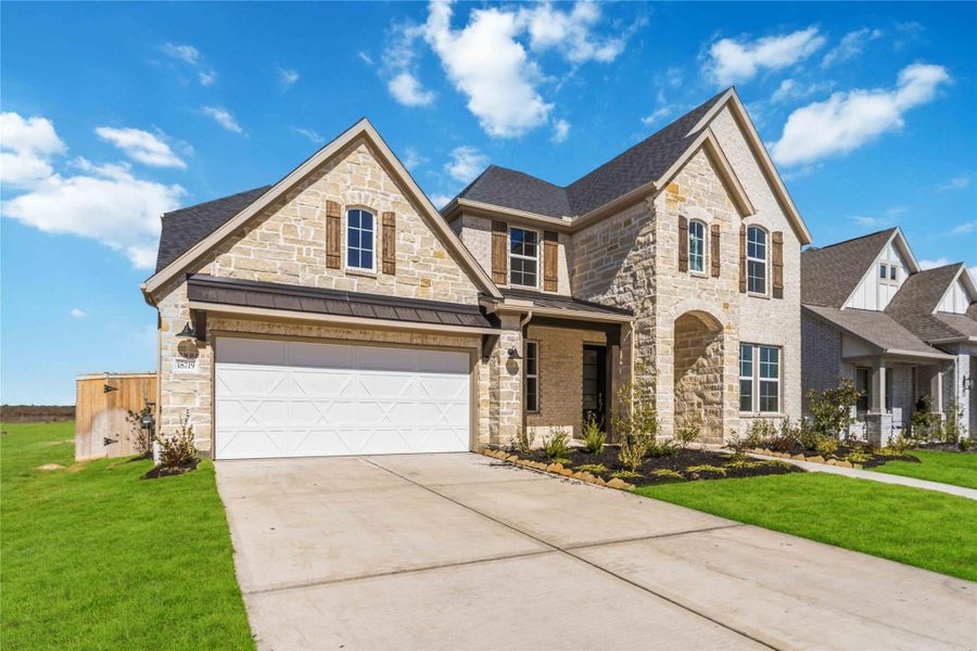 Front exterior of a new home in Valencia, Manvel, TX, highlighting curb appeal (Image 2). Front exterior of a new home in Valencia, Manvel, TX, highlighting curb appeal (Image 2).