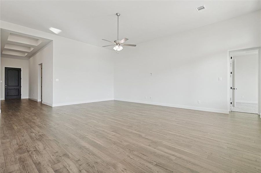 Spare room with light hardwood / wood-style flooring and ceiling fan