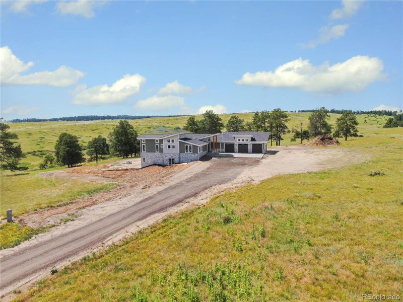 Front exterior of a new home in , Kiowa, CO, highlighting curb appeal (Image 27).