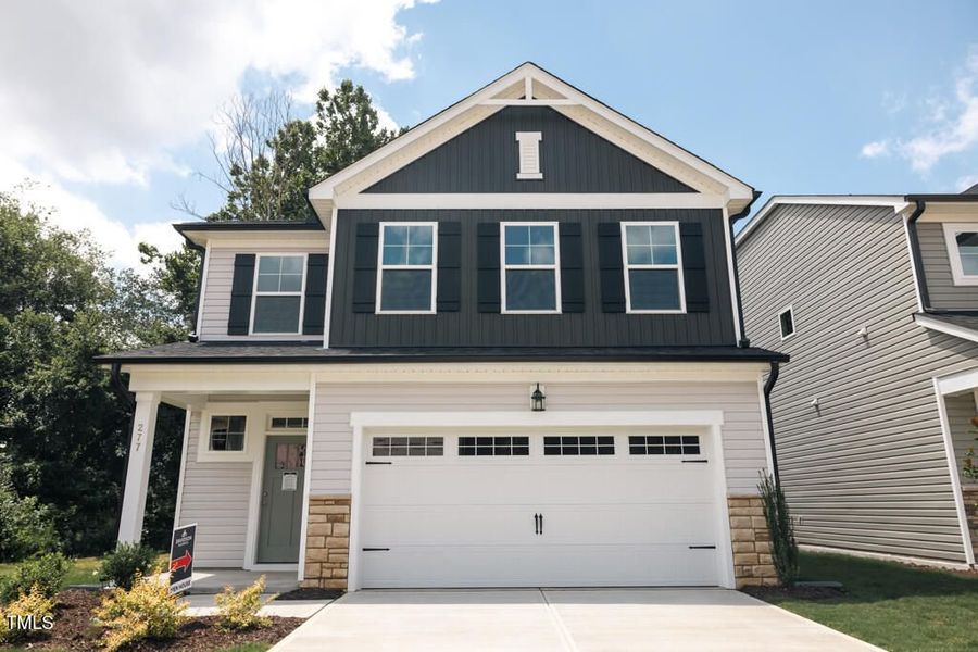 Front exterior of a new home in Gregory Village, Lillington, NC, highlighting curb appeal (Image 69).