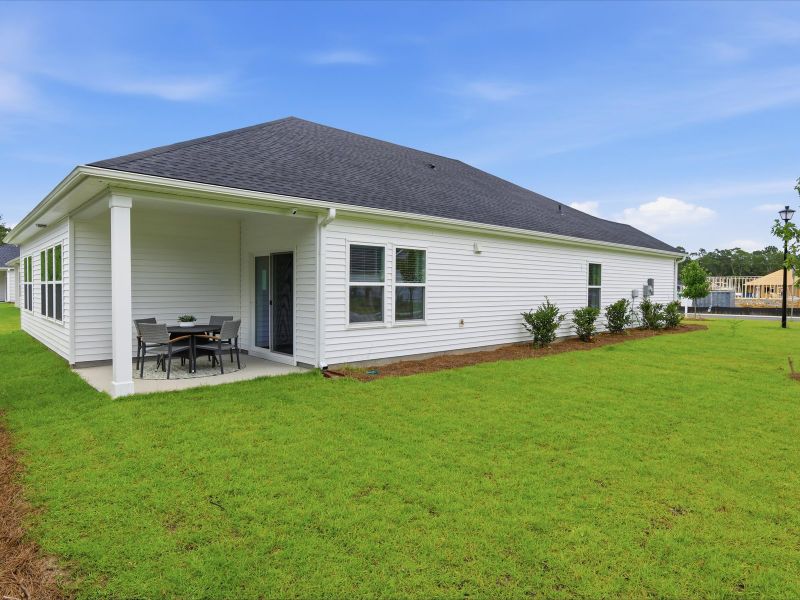Exterior details and patio area of a home in Palmetto Place, Longs (Image 3).