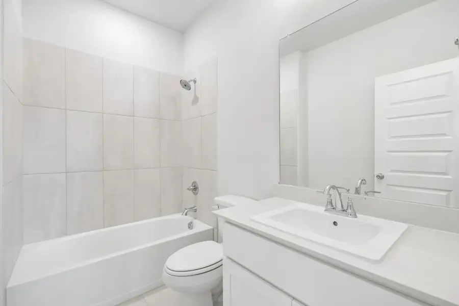 Bathroom in the Winters home plan by Trophy Signature Homes – REPRESENTATIVE PHOTO