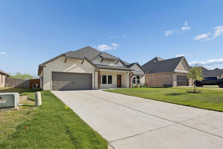 Front exterior of a new home in , Sherman, TX, highlighting curb appeal (Image 1). Front exterior of a new home in , Sherman, TX, highlighting curb appeal (Image 1).