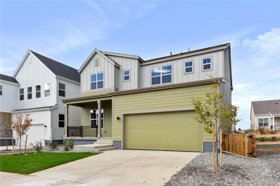Front exterior of a new home in , Broomfield, CO, highlighting curb appeal (Image 1).