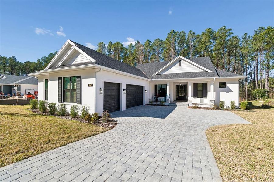Front exterior of a new home in , Brooksville, FL, highlighting curb appeal (Image 21).