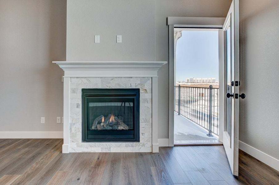 Gas Fireplace and Covered Terrace Entrance  - Not Actual Home - Finishes May Vary