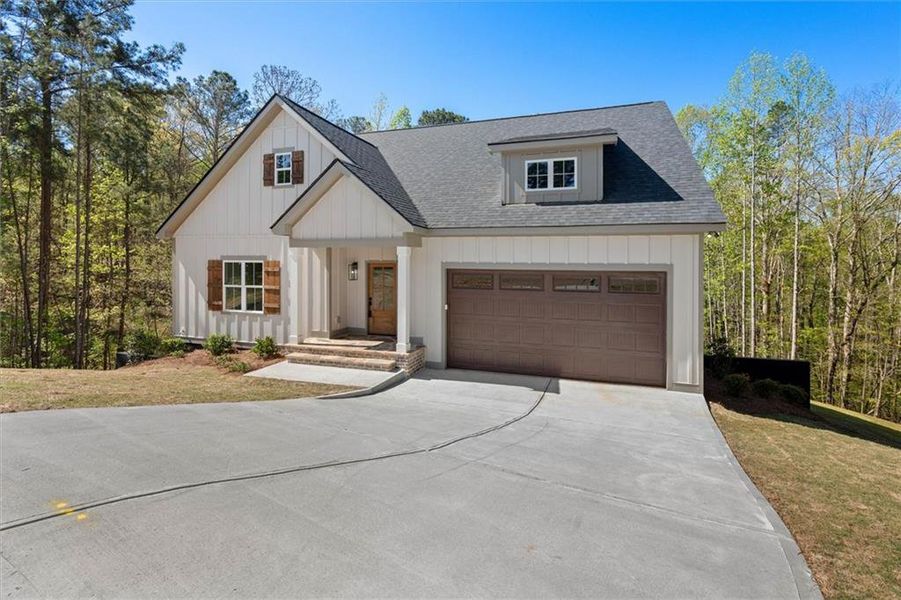 Front exterior of a new home in , Bremen, GA, highlighting curb appeal (Image 24).