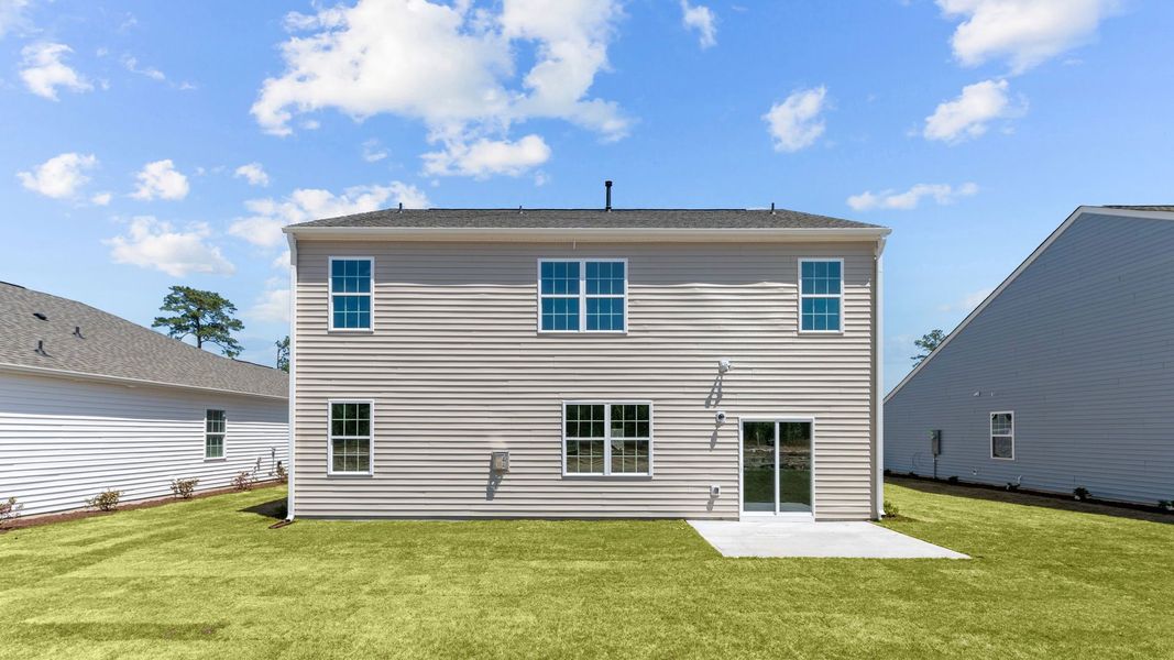 Exterior details and patio area of a home in East Ridge, Ayden (Image 3).