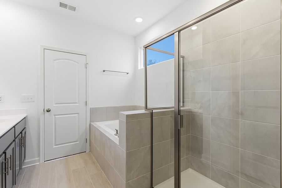 A bathroom with a glass shower.