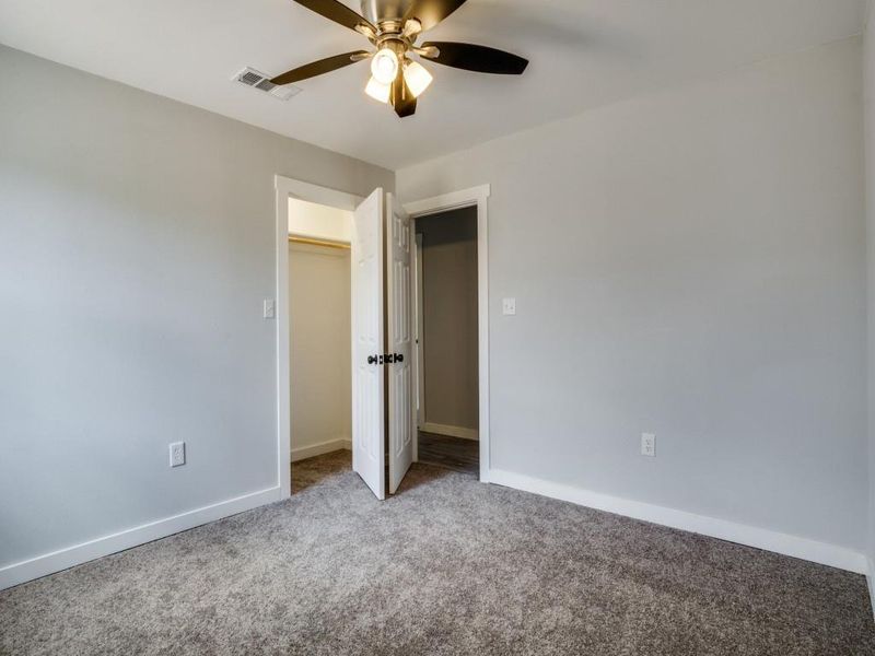 Unfurnished bedroom featuring carpet, a closet, and ceiling fan Unfurnished bedroom featuring carpet, a closet, and ceiling fan