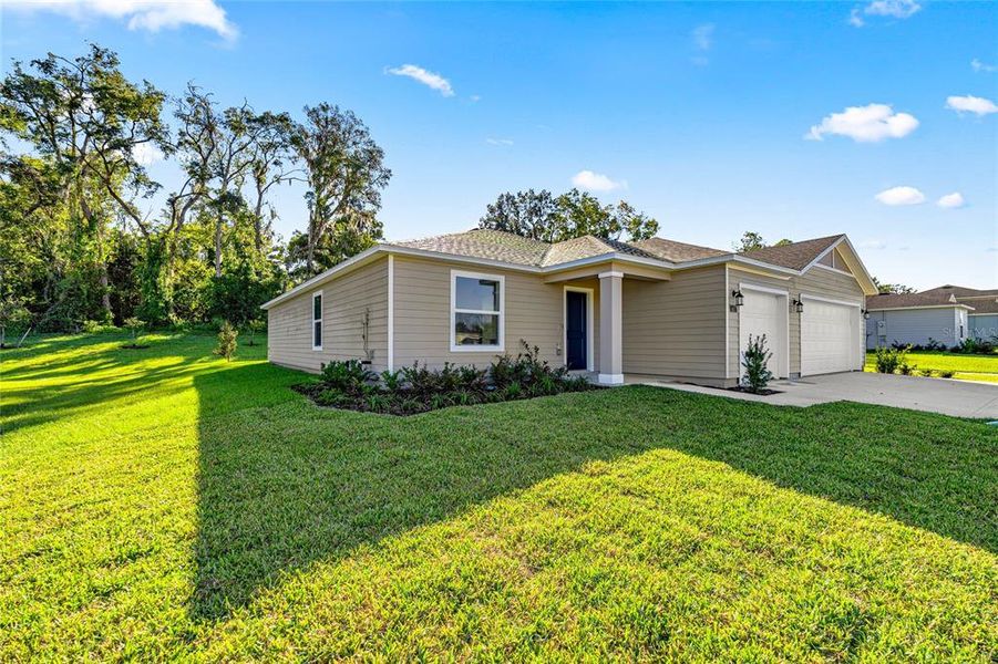 Front exterior of a new home in Marion Ranch, Ocala, FL, highlighting curb appeal (Image 2).